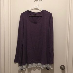 Long-sleeved purple top with white lace hem.
